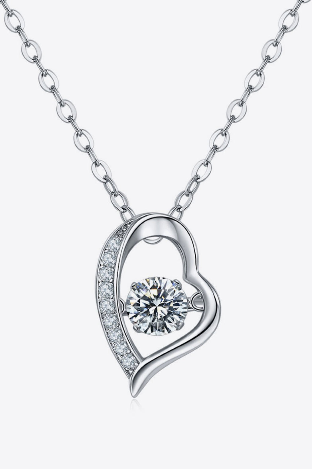 Silver heart pendant necklace with a moving diamond and cubic zirconia accents on a sterling silver chain.