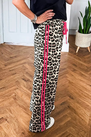 Leopard print maternity pants with pink side stripes and drawstring waist.