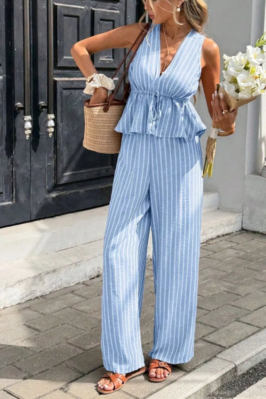 Light blue striped two-piece set with peplum top and wide-leg pants