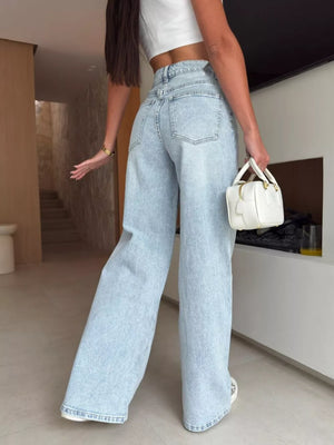 Light wash denim wide leg jeans with a high waist and lace-up detail.