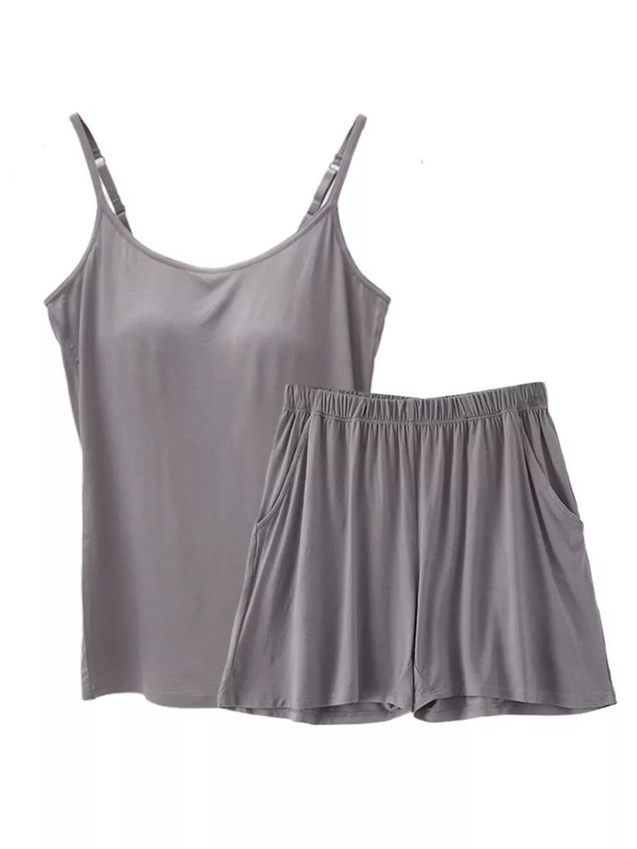 Gray cami and shorts pajama set with adjustable straps and pockets.