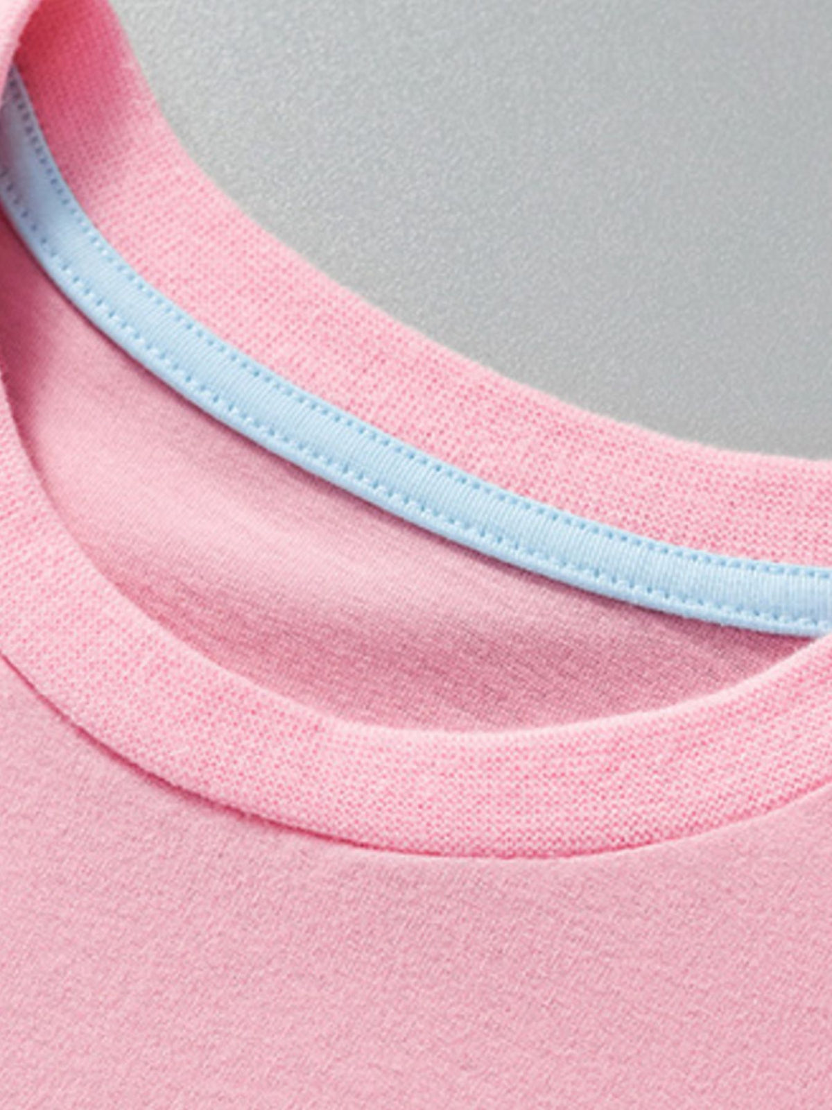Pink baby t-shirt with blue trim on neckline