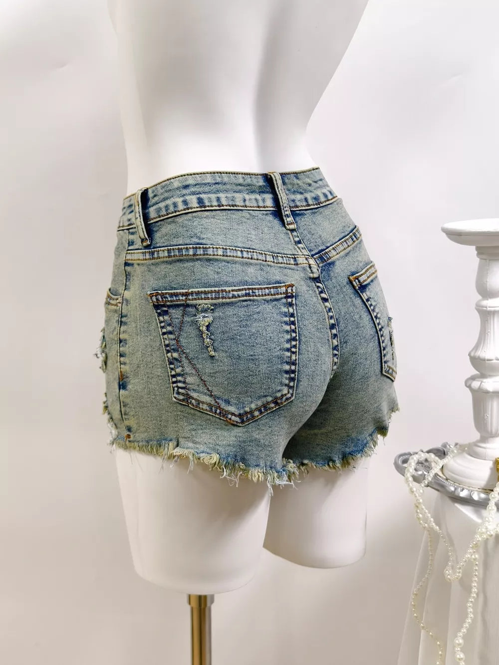 denim shorts in Light with distressed and mini