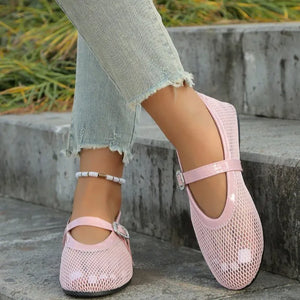 Pink mesh ballet flats with buckle detail and ankle strap.
