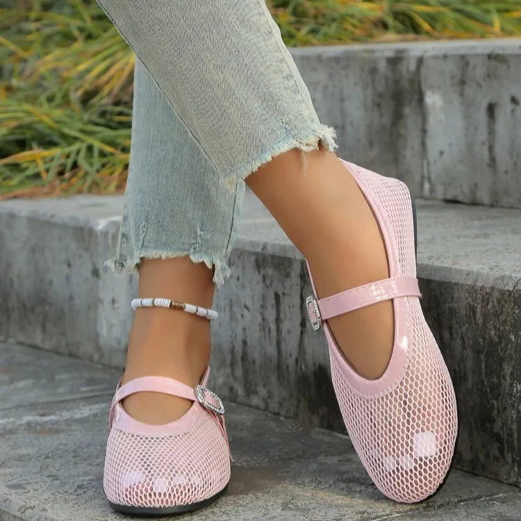 Pink mesh ballet flats with buckle detail and ankle strap.