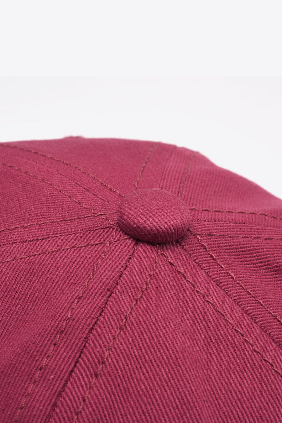Deep Red baseball cap with stitched panel detail and button top.