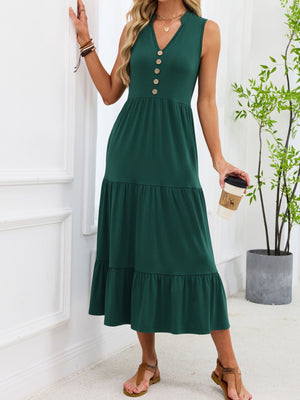 Dark green tiered midi dress with notched V-neck and decorative buttons.