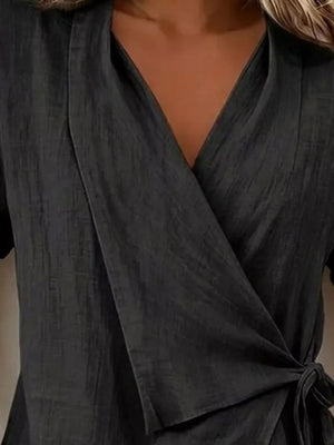 Black relaxed wrap top with v-neck