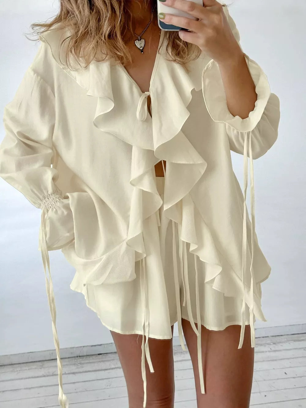 blouse in ivory featuring tied and relaxed fit
