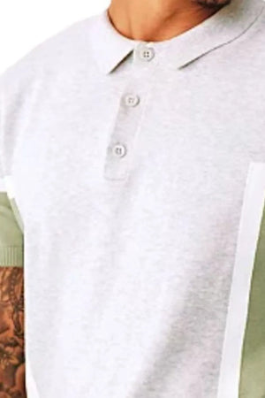 Geometric panel knit polo shirt in light grey with matcha green accents and buttoned placket.