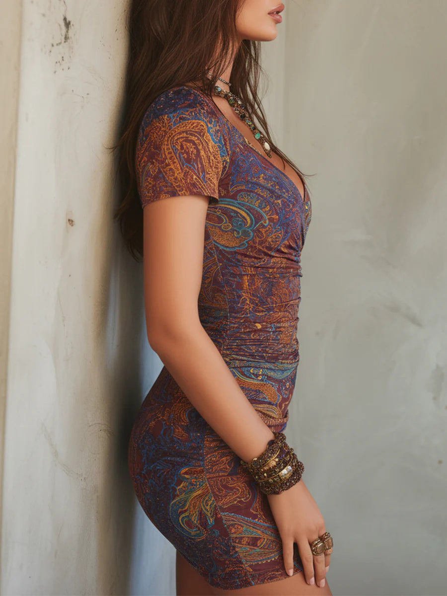 golden yellow mini dress featuring ruched and paisley