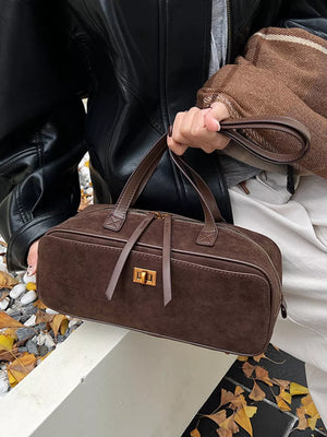 Brown suede shoulder bag with gold clasp and top handles