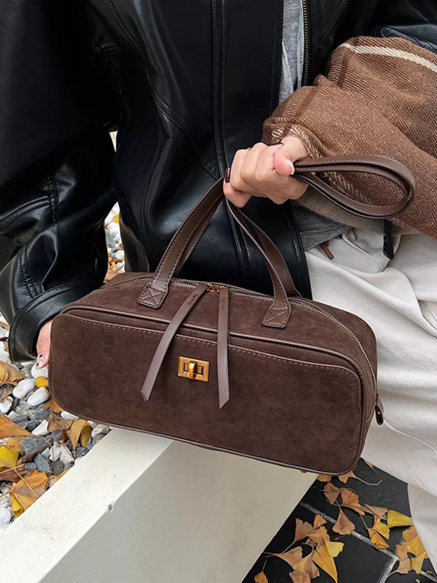 Brown suede shoulder bag with gold clasp and top handles