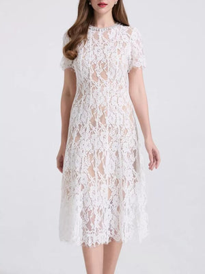 White lace midi dress with pearl embellishments and short sleeves.