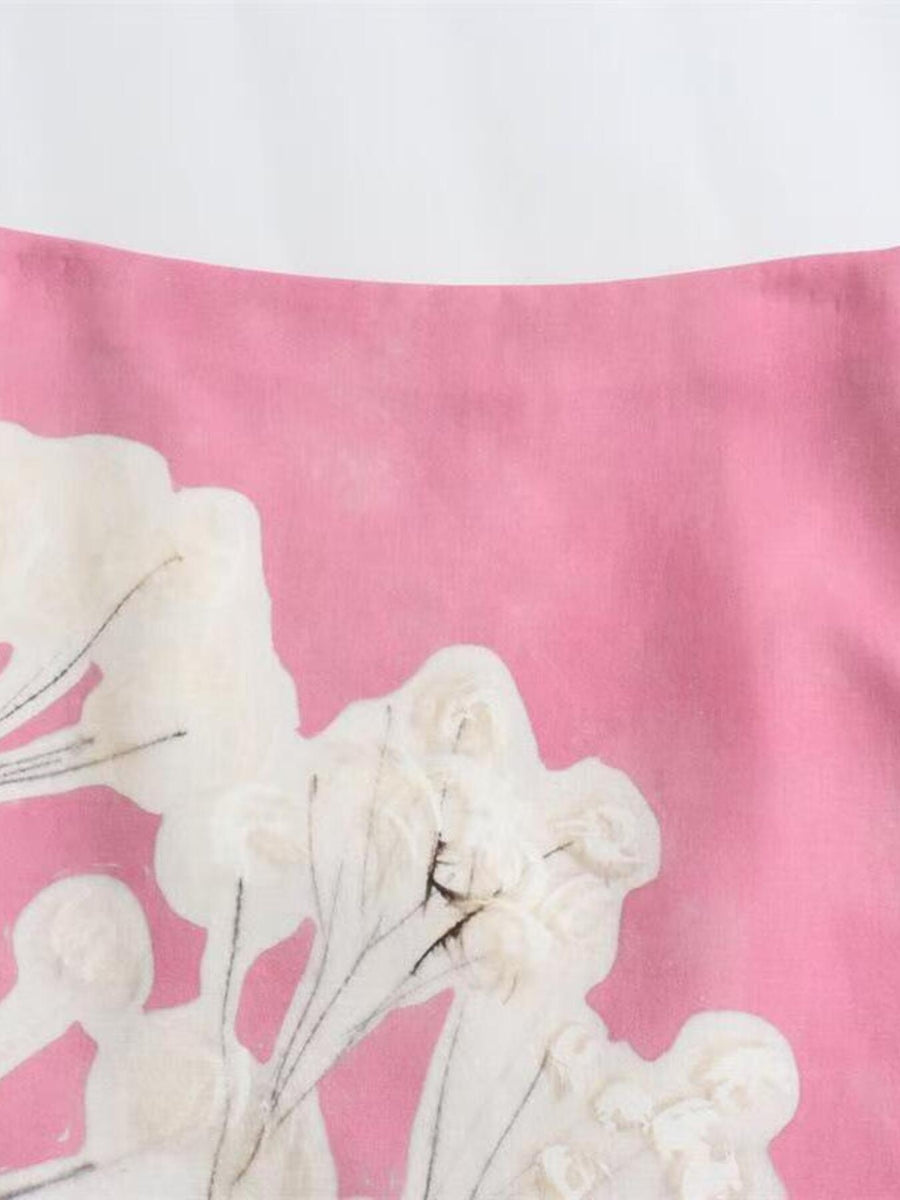 Vibrant floral print skirt in pink with white abstract floral details.