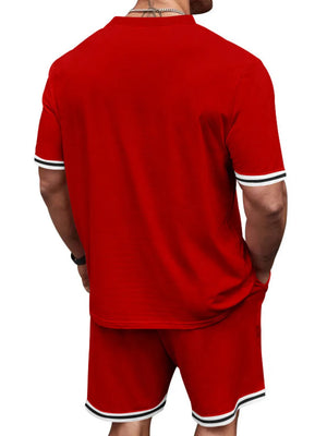 Red t-shirt and shorts set with white and black striped trim on sleeves and hem