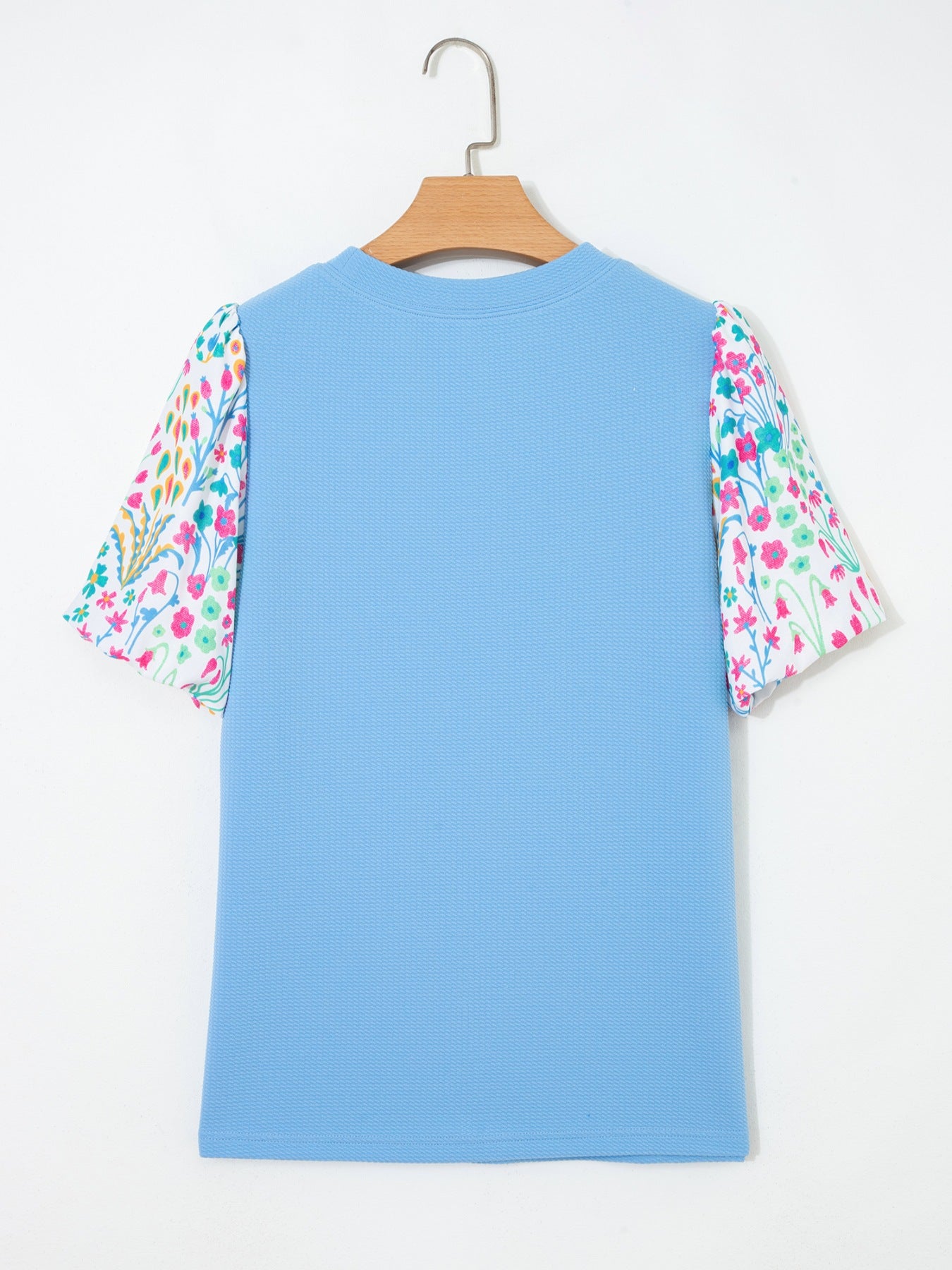 Textured blue blouse with abstract floral bubble sleeves