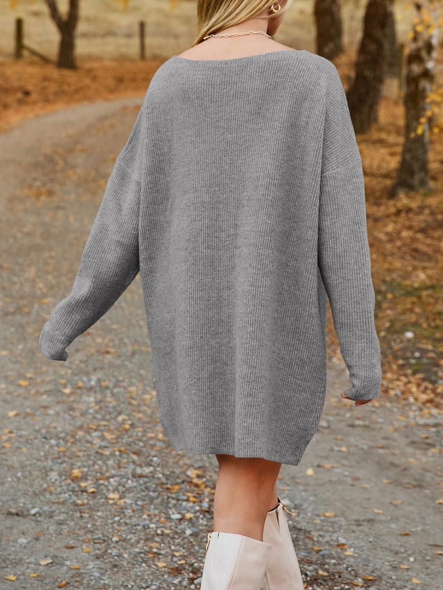 Gray ribbed knit oversized mini dress with long sleeves and a boat neckline.