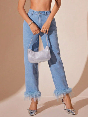 Light wash denim jeans with feather trim at the hem and a high rise.