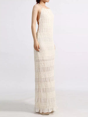 Maxi dress in ivory with textured horizontal ruching and a halter neckline.
