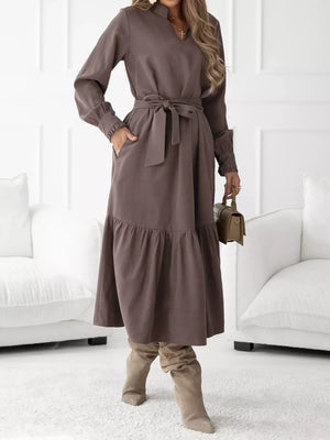 Coffee brown midi dress with ruffle hem, tie waist, and long sleeves.