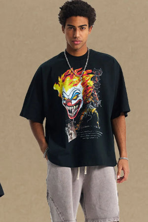 Black oversized t-shirt with a bold clown graphic print and short sleeves.