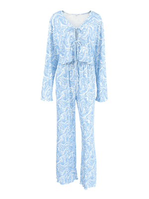 Blue and white marble print lace-up lounge set with drawstring pants and long sleeves.
