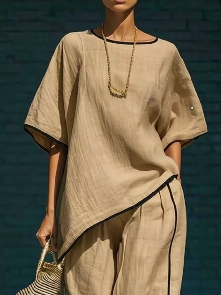Khaki two-piece set with contrast trim, featuring a cropped pant and loose top.