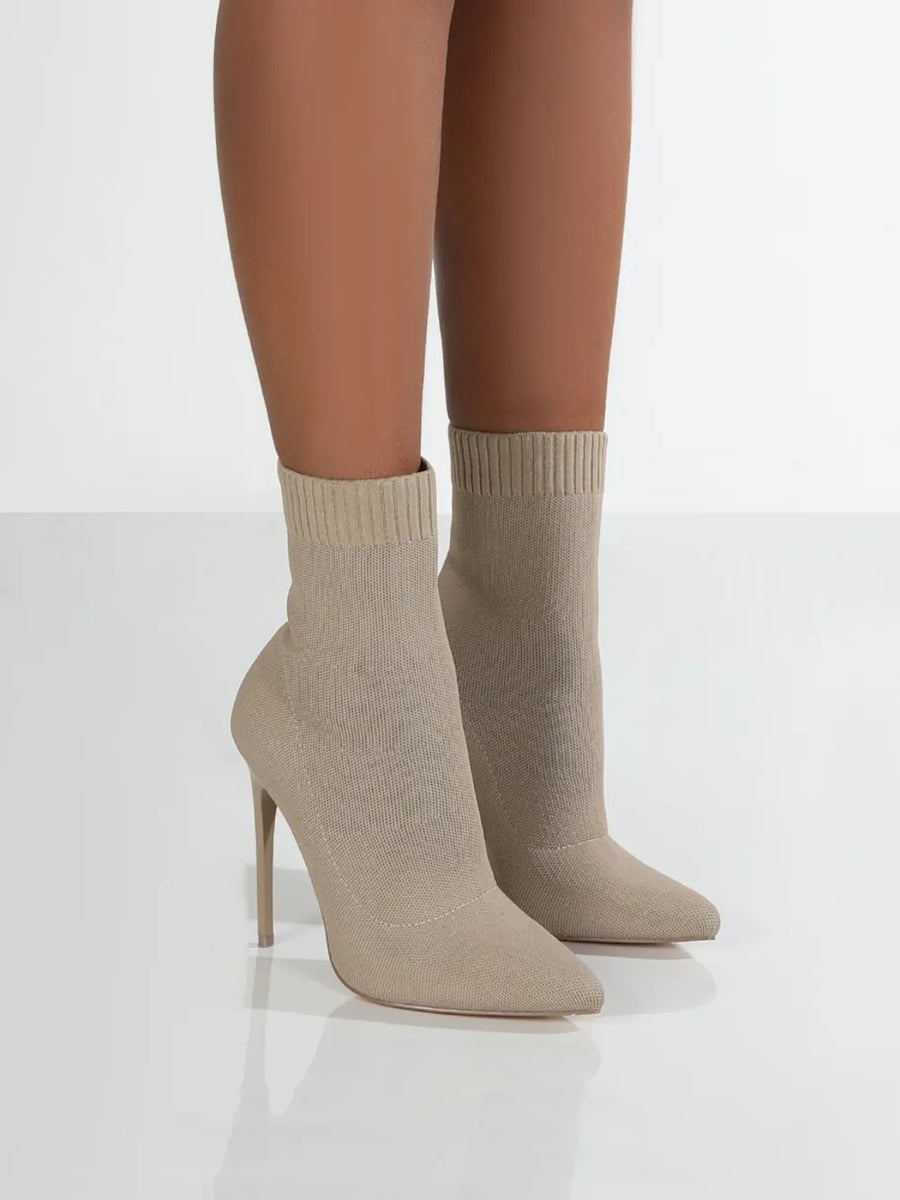 Beige knit sock booties with pointed toe and stiletto heel
