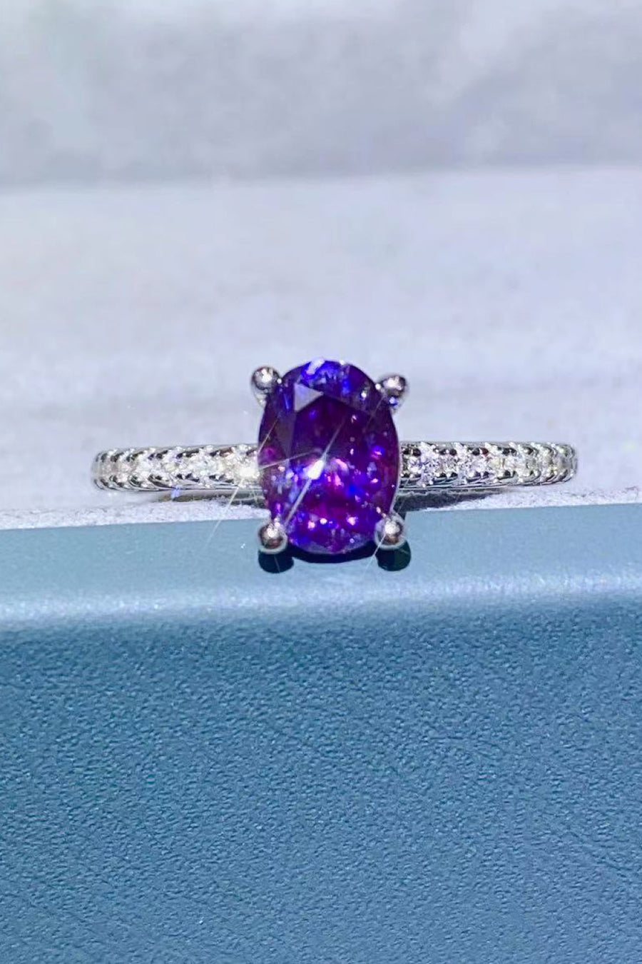Amethyst oval pavé ring with a silver band.