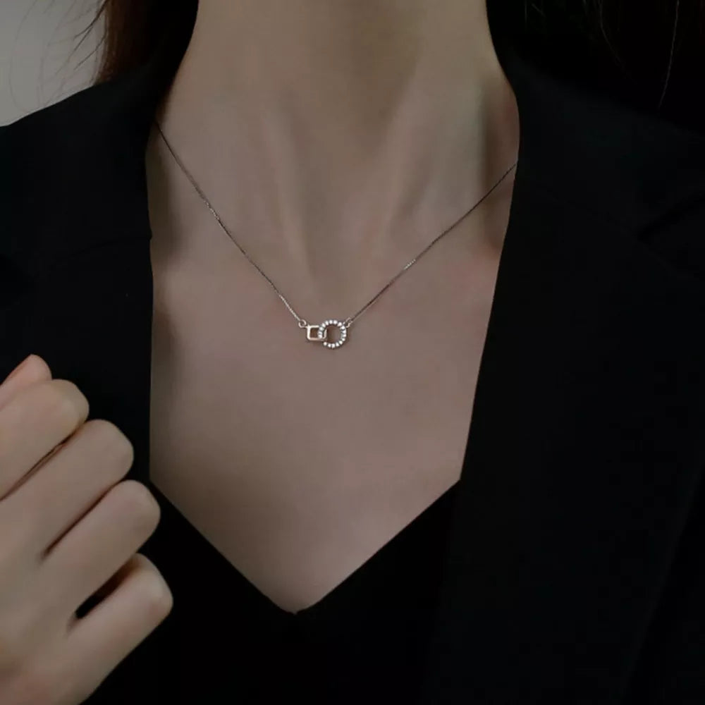 clear necklace featuring zircon embellishment and geometric
