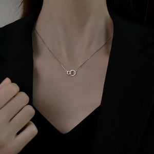 clear necklace featuring zircon embellishment and geometric