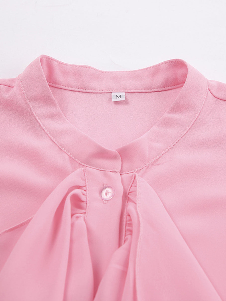 Pink ruffled flounce sleeve blouse with button detail and a tie neck.