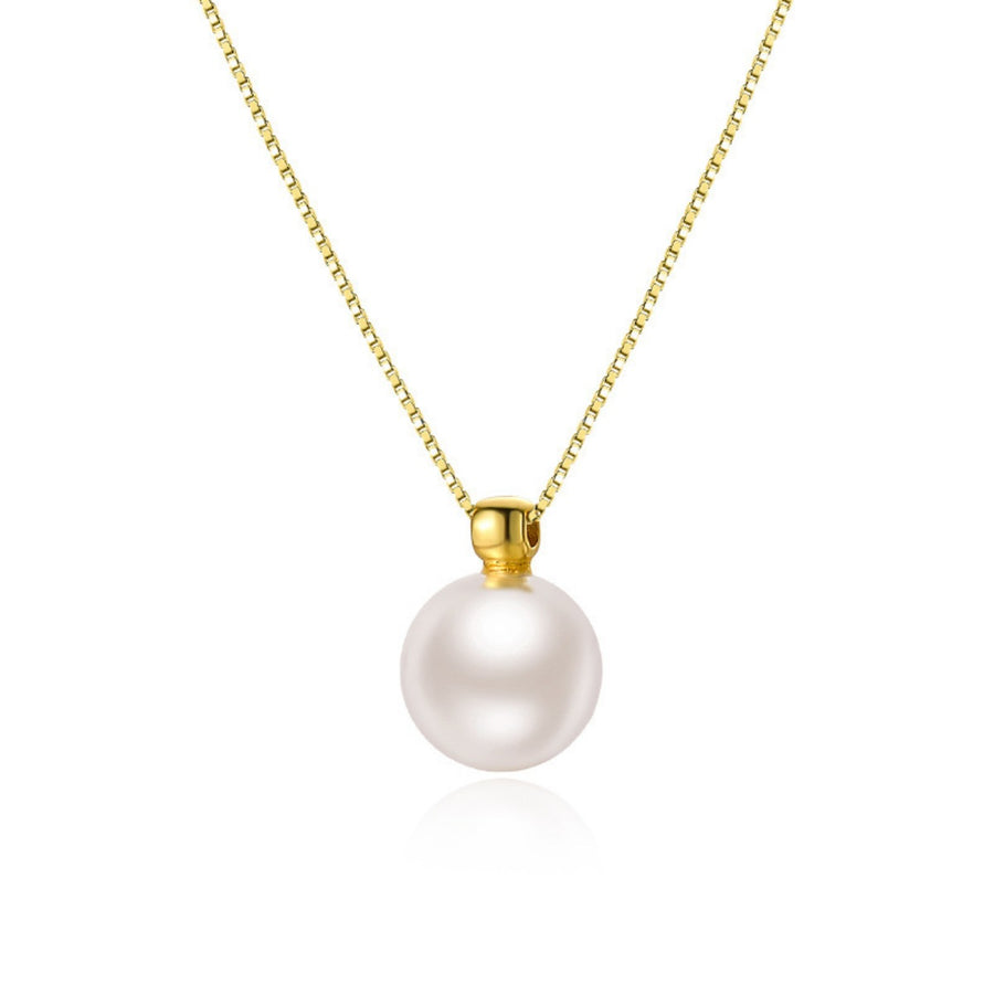 Gold chain necklace with a single white pearl pendant.