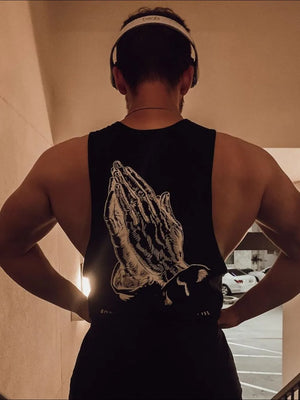 Black muscle tank top with praying hands graphic on back