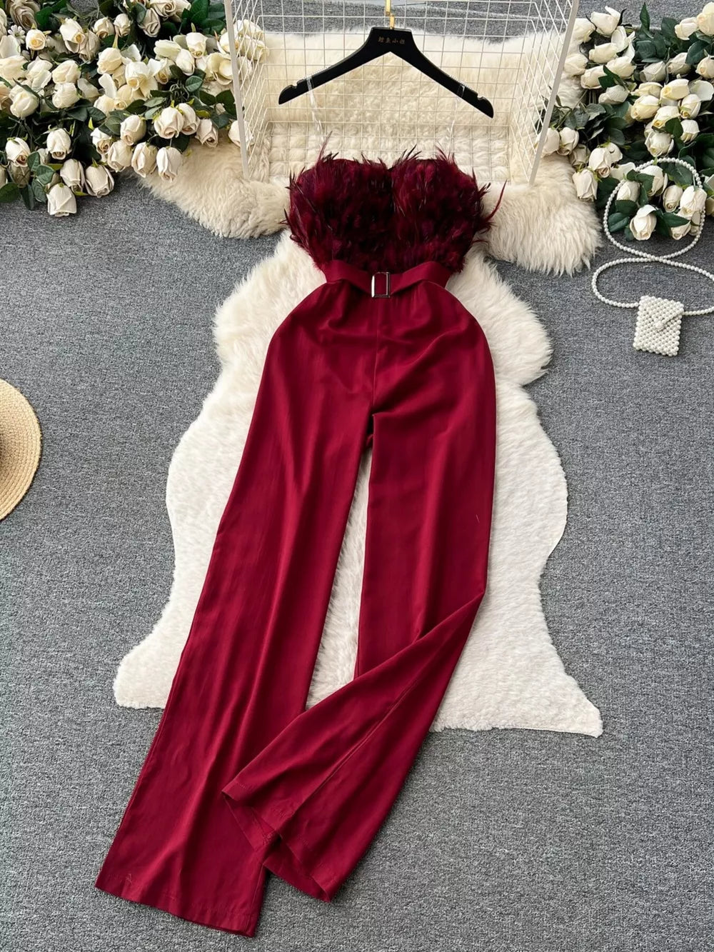 Wine red strapless wide-leg jumpsuit with feather trim and belt