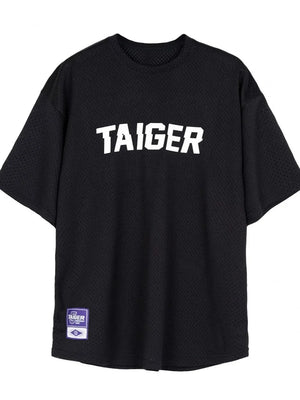Black mesh oversized t-shirt with white TAIGER graphic and tag detail.