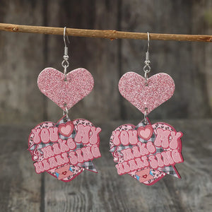Blush pink glitter heart earrings with text and leopard print detail