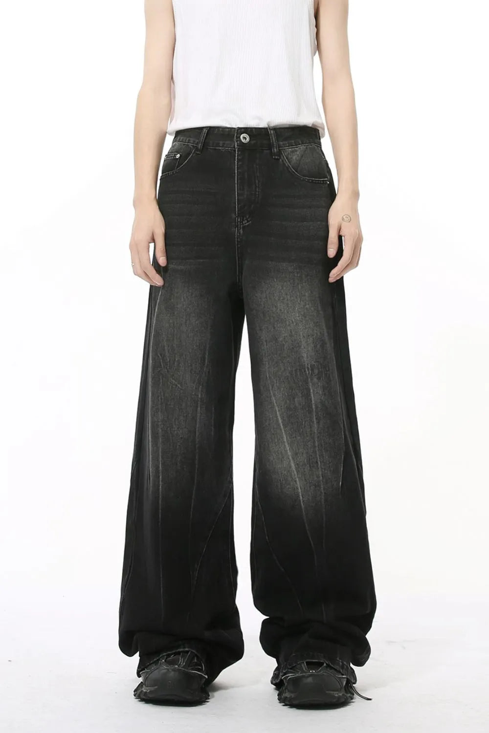 Dark wash wide leg jeans with a relaxed fit and faded details.