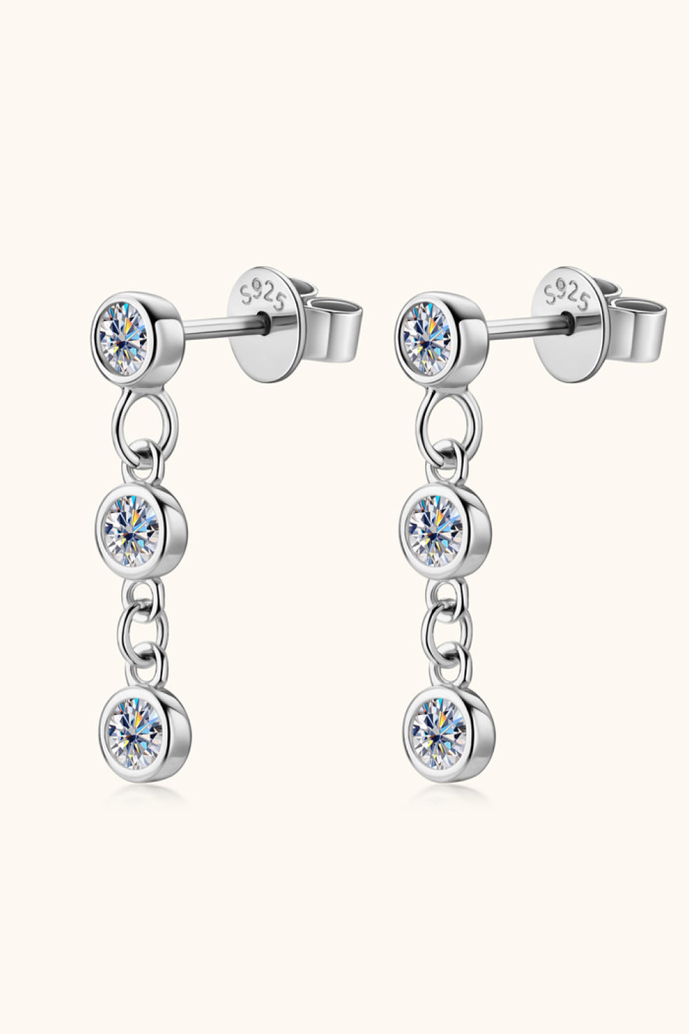 Silver triple stone cascade drop earrings with clear cubic zirconia accents.