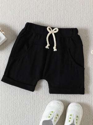 Black cotton baby shorts with drawstring and cuffed hems