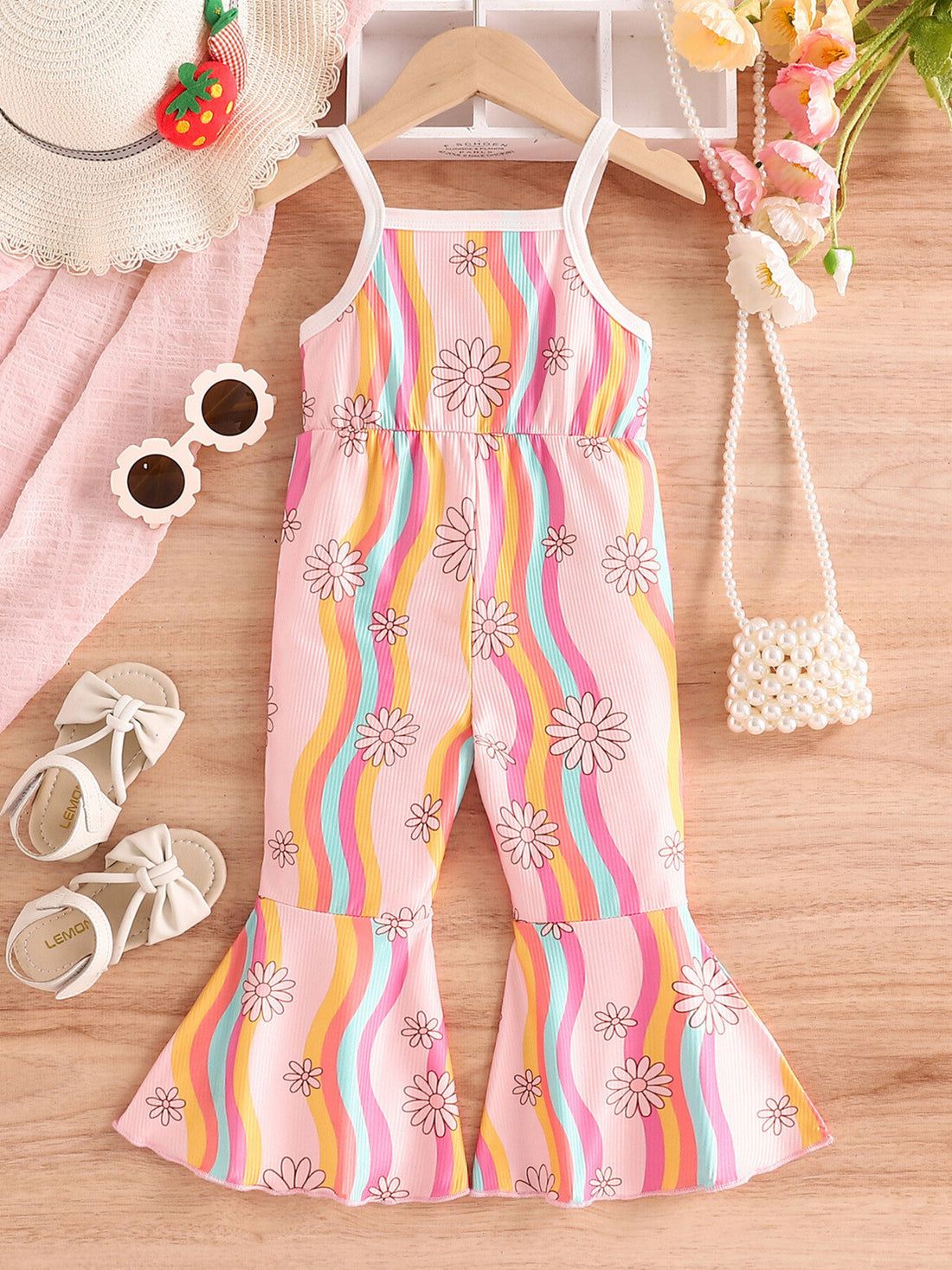 Baby floral print flared jumpsuit with rainbow stripes and spaghetti straps.