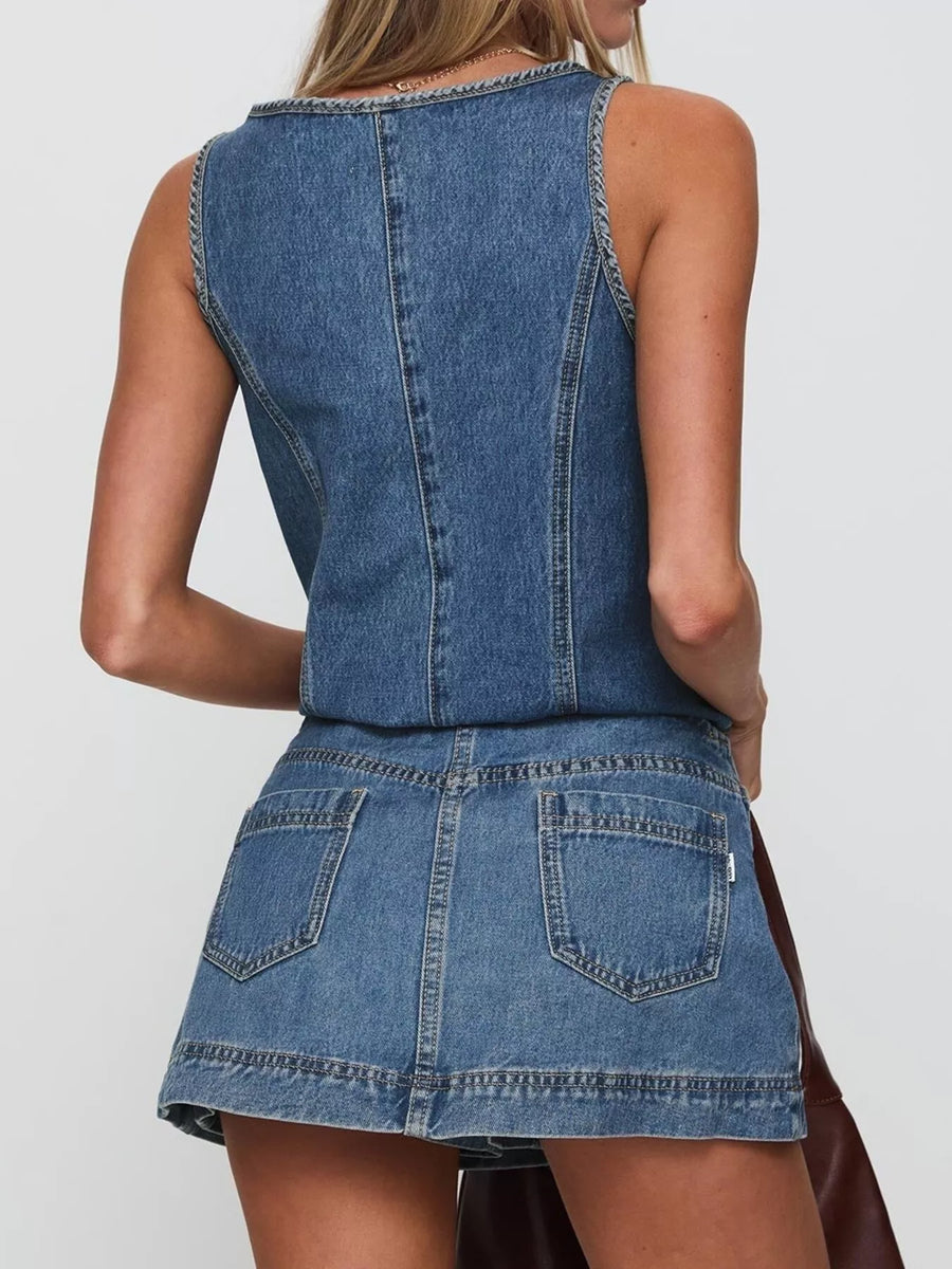 Blue denim tank top and skirt set with visible stitching and back pockets.