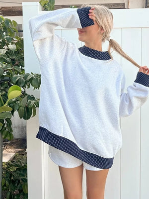 navy blue sweatshirt featuring dropped shoulder and polka dot