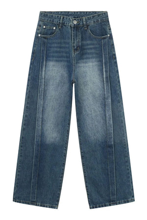 Medium wash denim jeans with vertical seams and wide legs.