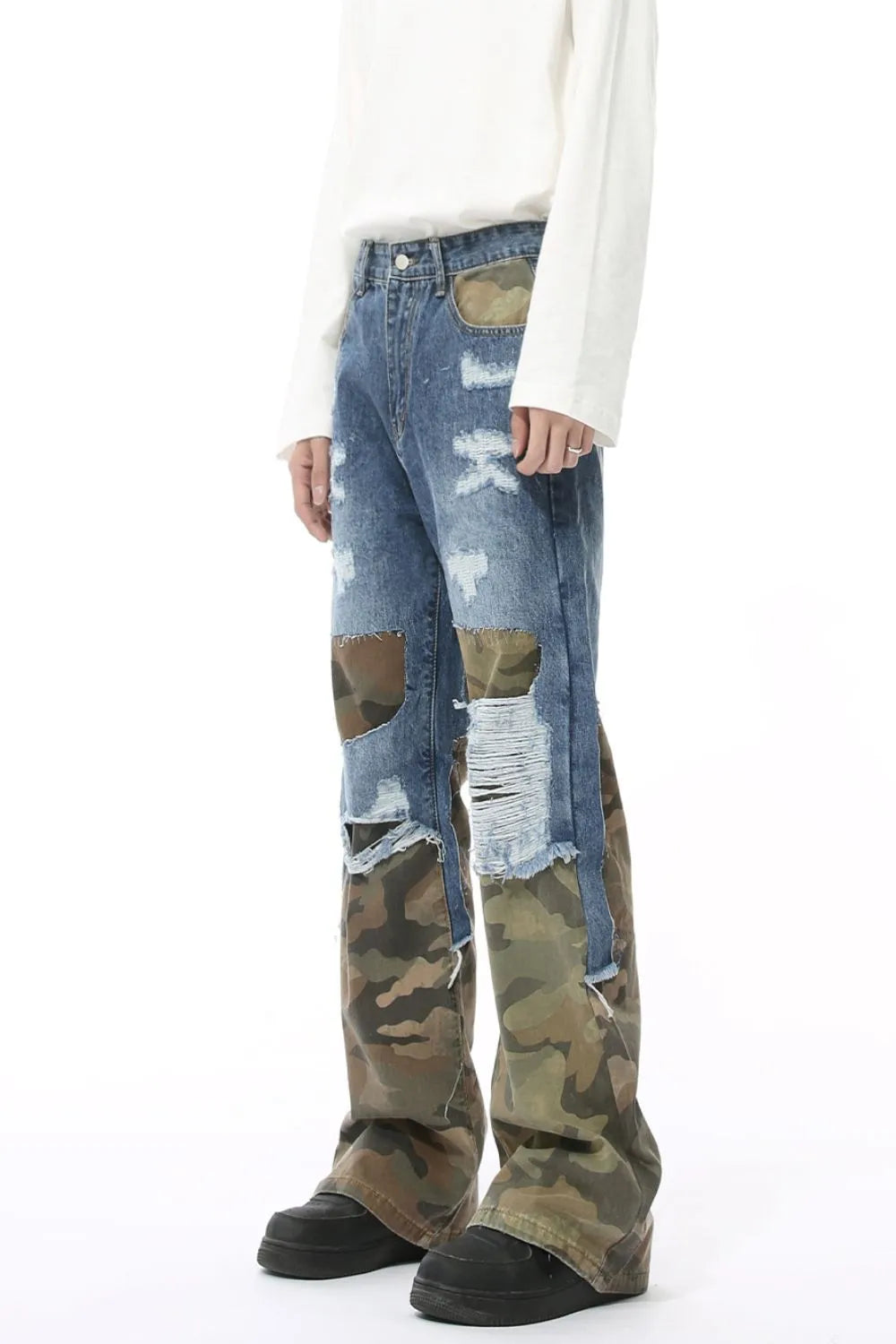 Camouflage panel distressed wide-leg jeans in blue denim with ripped details.