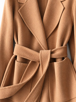 wool coat in black with pocketed and hip-length