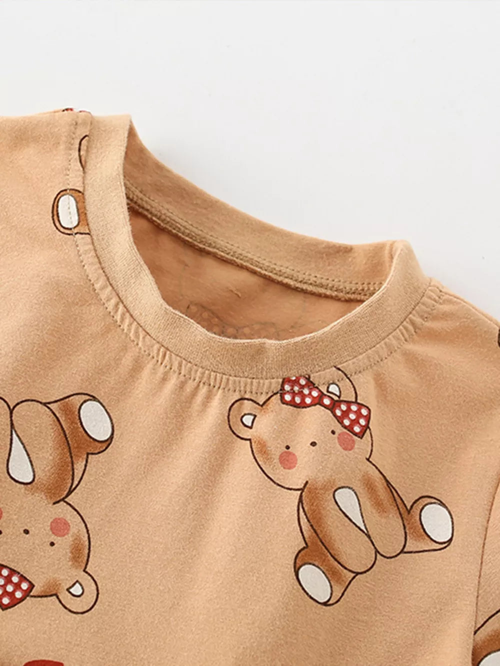 Baby dress in cotton blend with allover bear print and red bow detail.