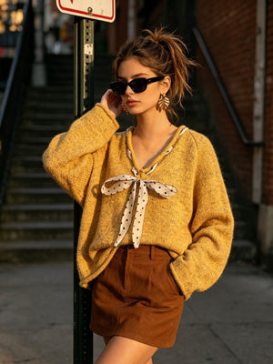 v-neck sweater in Wine Red with tied detail and hip-length