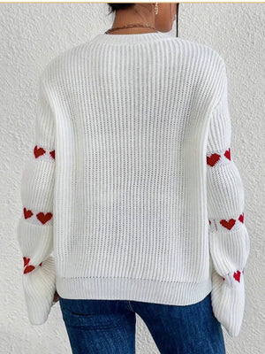 100% polyester Care instructions: Machine wash cold pullover sweater in Red Apricot with relaxed silhouette